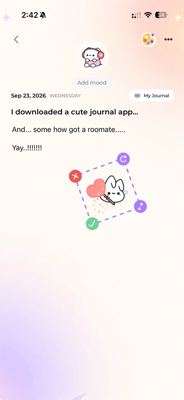 Placing a sticker on a journal page, with rotate and resize handles